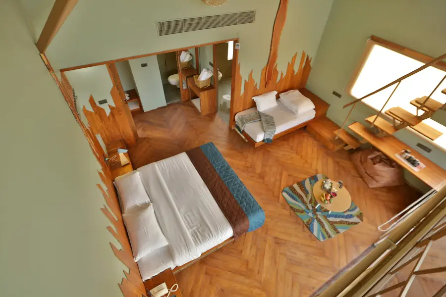 Balcony day-bed overlooking the grassland at a luxury stay