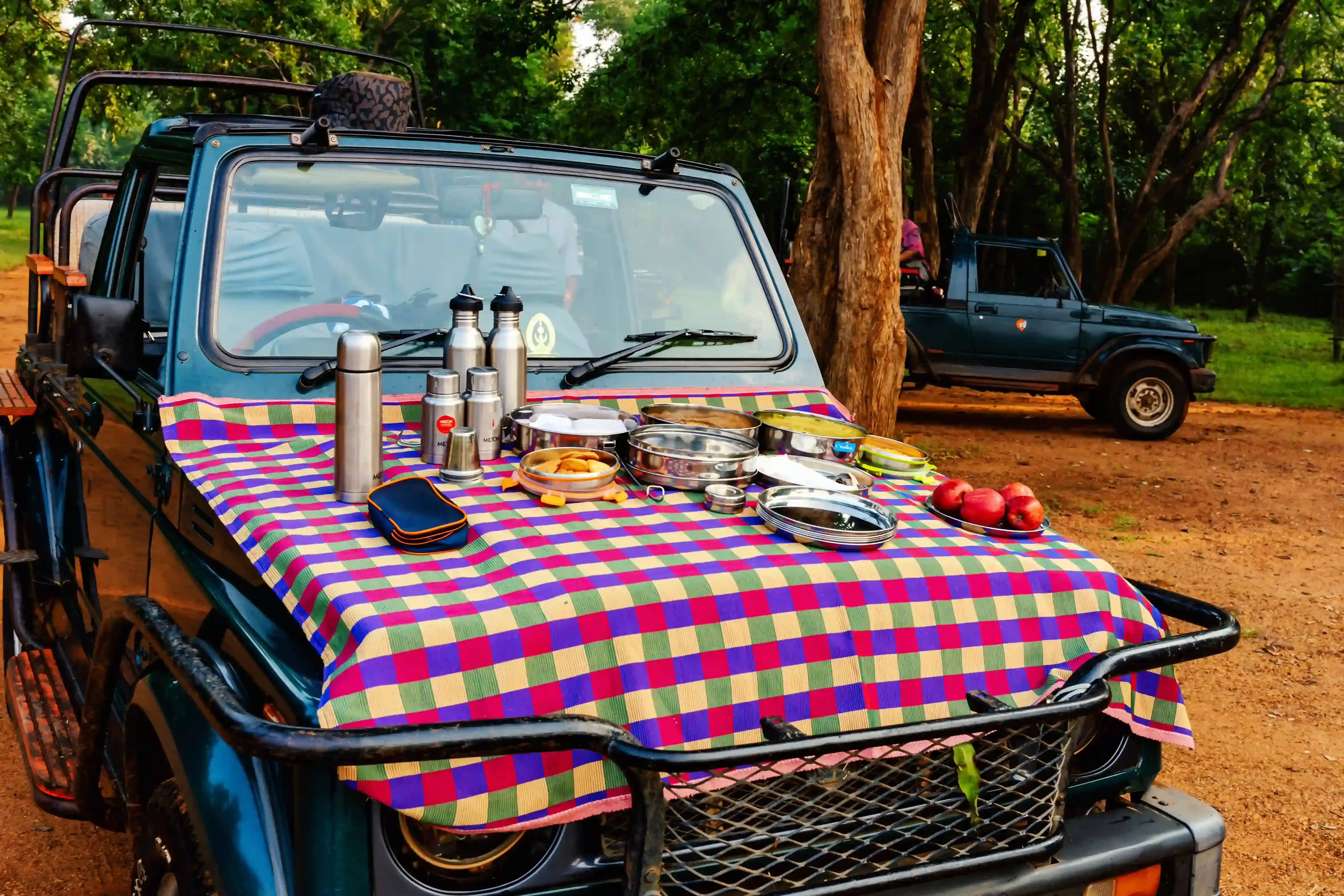 Breakfast laid out on the bonnet of a safari Gypsy
