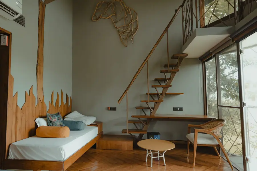 Jungle-print textiles and woodwork detail in a room at a luxury stay
