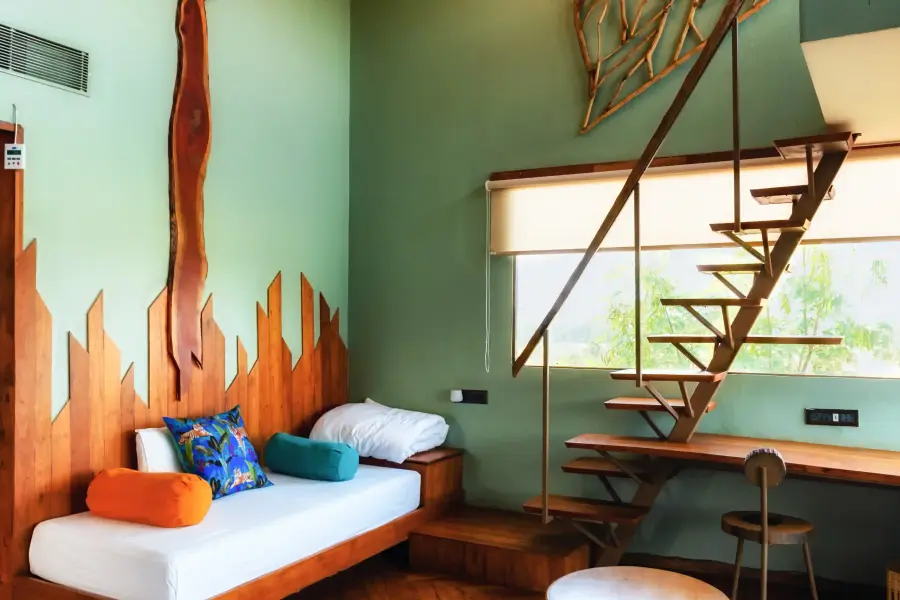 Room finished in stone and reclaimed wood at a luxury stay
