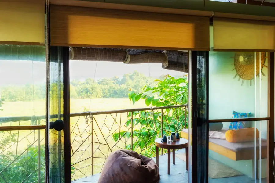 Jungle-print textiles and woodwork detail in a room at a luxury stay