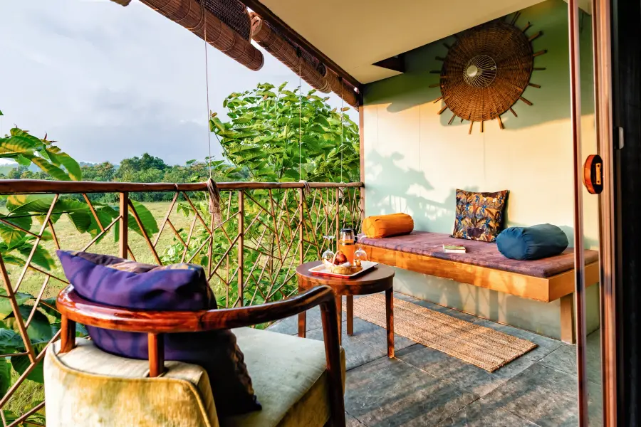 Jungle-print textiles and woodwork detail in a room at a luxury stay