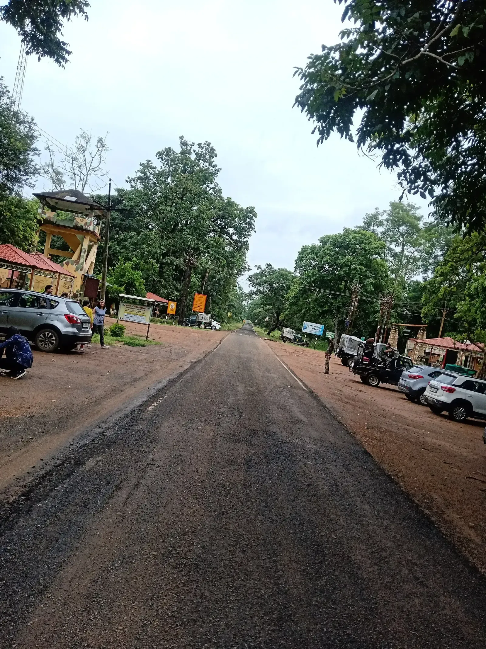 Road and parked safari vehicles at Agarzari gate, Tadoba buffer