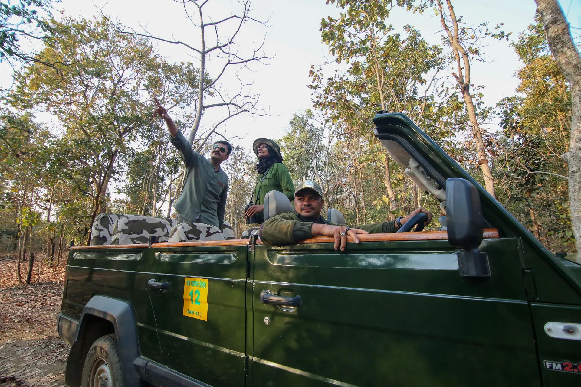 Guests scanning the Pench forest with a naturalist
