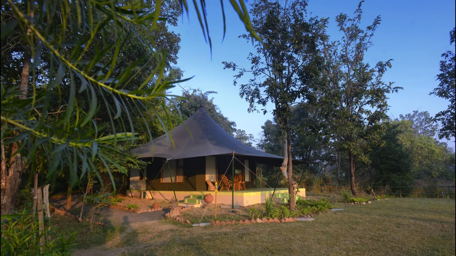 Luxury safari tent among the trees at a jungle camp near Pench