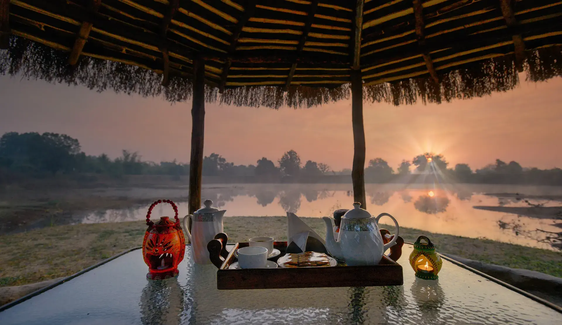Morning tea set out by the water before a Pench drive