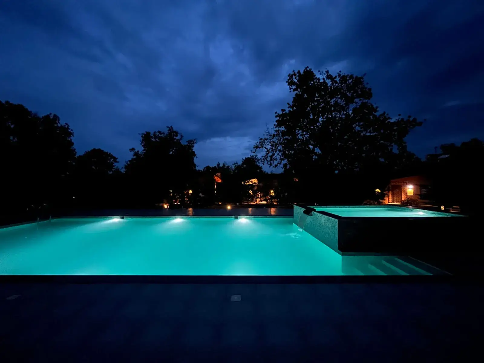 Resort pool lit up at night