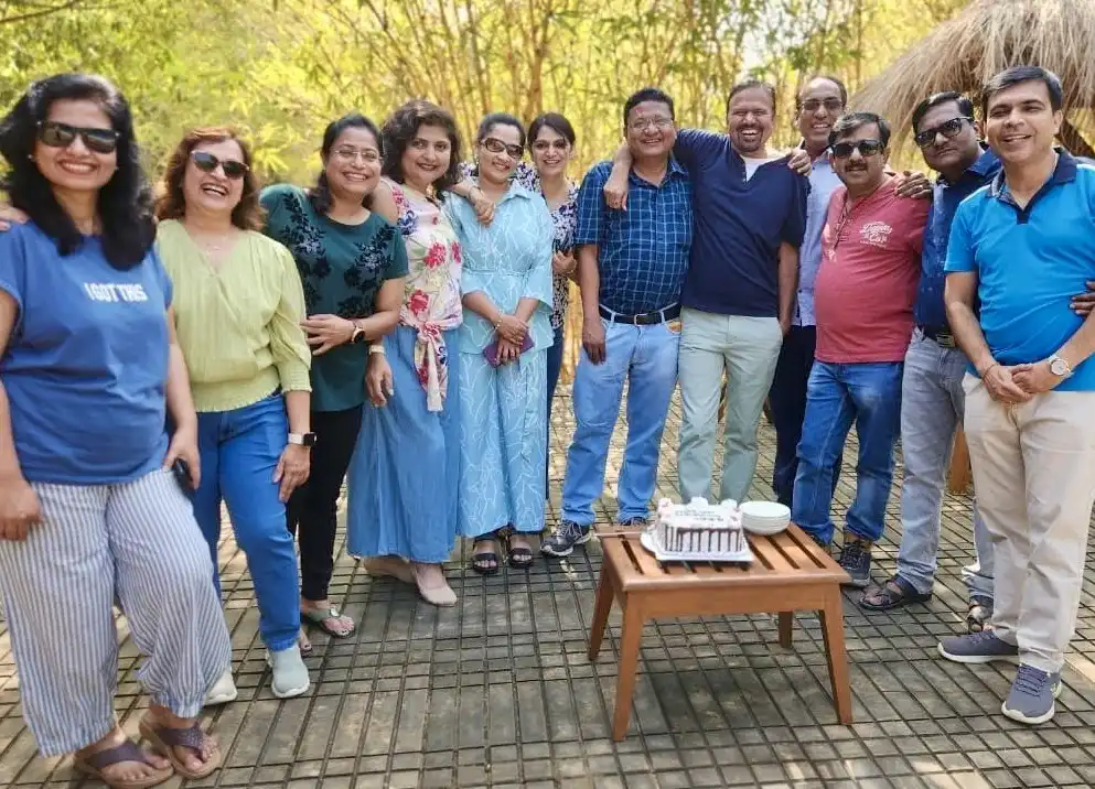 Corporate team enjoying a wildlife safari tour, exploring nature and bonding in a scenic outdoor setting