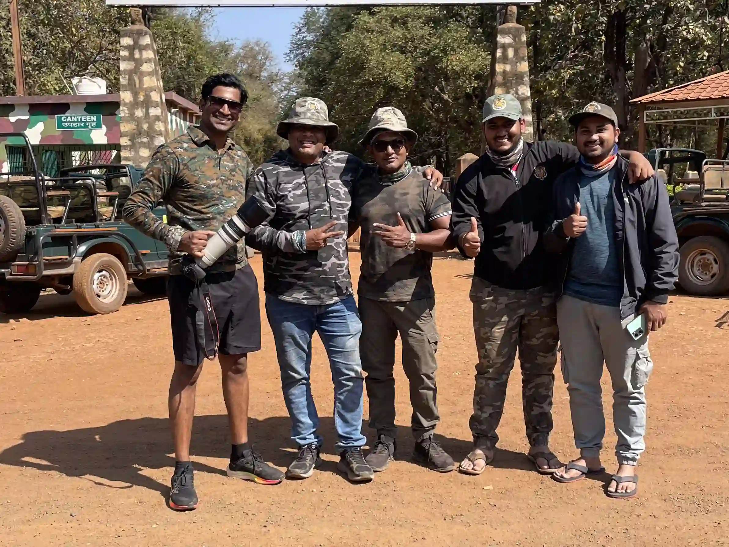 Group of photographers on a wildlife photography tour, capturing stunning wildlife shots in a beautiful natural setting.